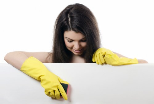 Cleaner treating stains on a sofa in a South Kensington property